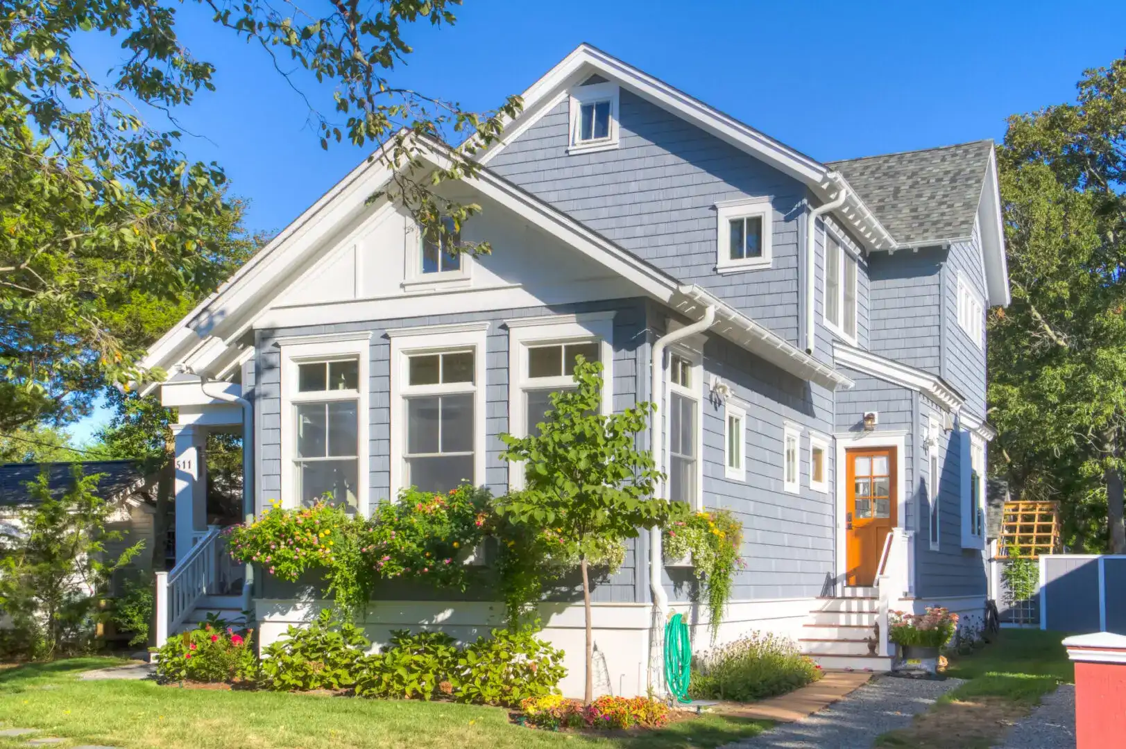 A house with blue siding and white trim.